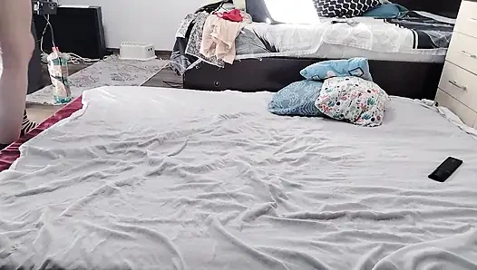 Sexy brunette doing naked chores around the house.