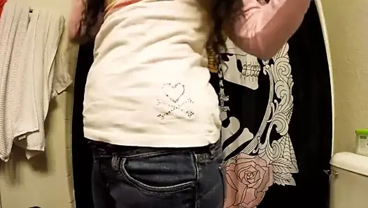 Curly haired girl farting in jeans