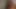 Siyah kıyafetli kıvırcık saçlı sulu orta yaşlı seksi kadın çifte penetrasyon hissetmek için uzun pembe dildo kullanıyor