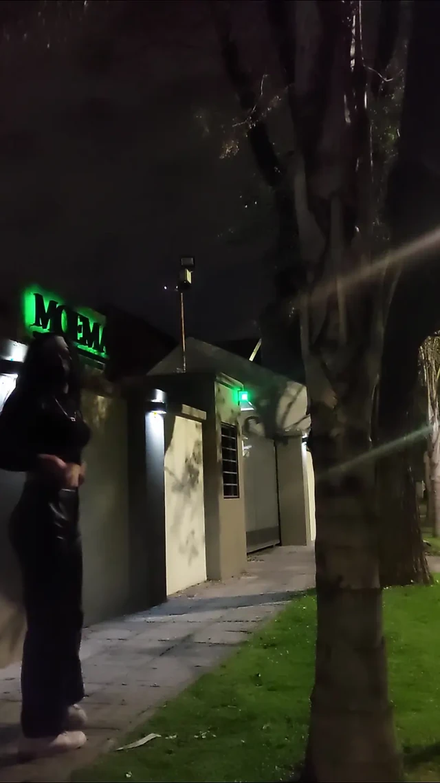 Crossdresser public walk wearing leather pants