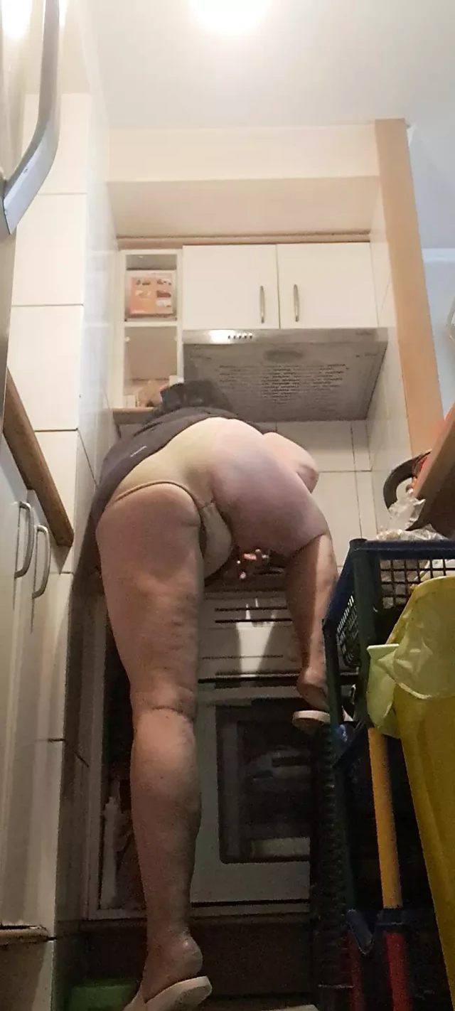 in the kitchen, relaxed, supported on her back