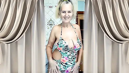 A Mature Woman Performs a Striptease in the Kitchen