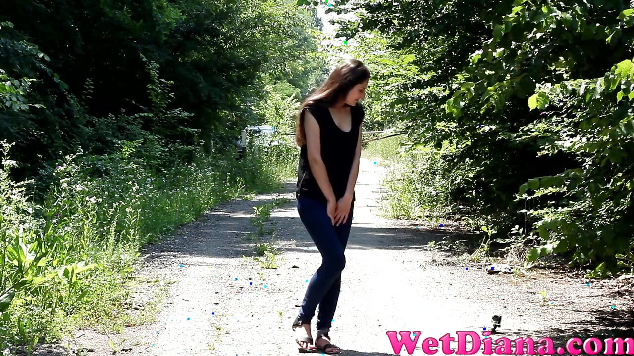 Wide open legs peeing outdoor and Desperate to pee, she has to pee in front of the car in her jeans