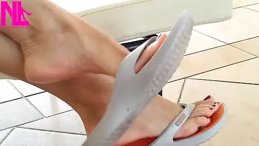 Dangling with Orange Flip Flops in a Swimming Pool