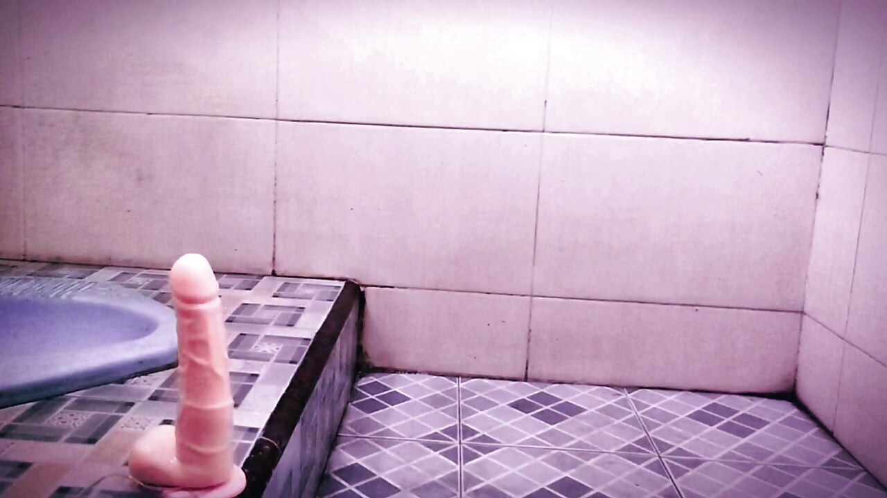 Newbie femboy secretly uses sex toy in the bathroom.