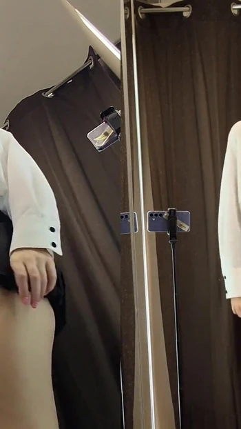 Stunning moment from "Public Skirt Tease in the Fitting Room - Risky Flash from Every Angle"