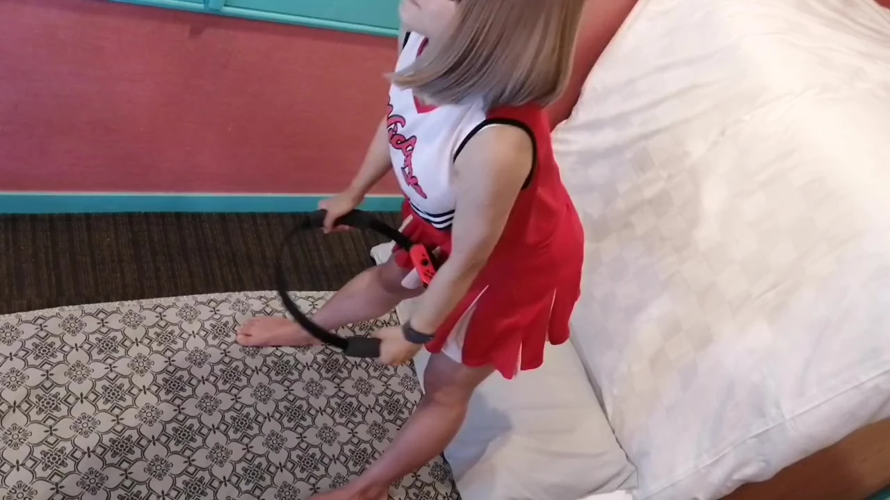 A cute, busty married woman performs exercise 4 in an erotic cheerleader costume. Peeking down from above. Home made amateur Private Shoot