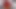 Russian girl dressed in shiny red latex toys her own asshole
