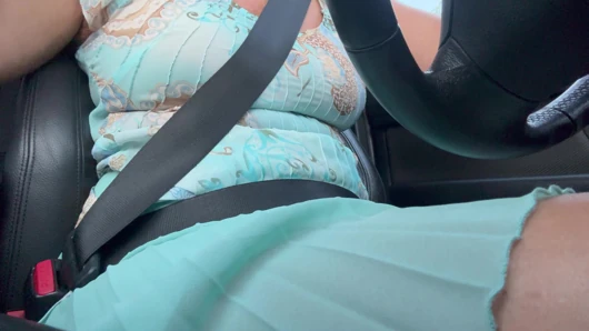 An elegant lady drives to work and rubs her pussy with her hand between her hot thighs