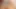 Web kostümlü seksi sarışın genç bronzlaşmış yüzünü kapalı alır
