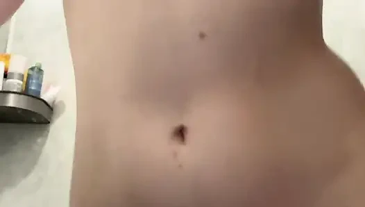 Wet girl caresses her body in the shower