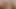 Kızıl saçlı genç güzel kız seksi striptiz yapıyor ve ağzında dildo ile seks makinesi hazırlıyor