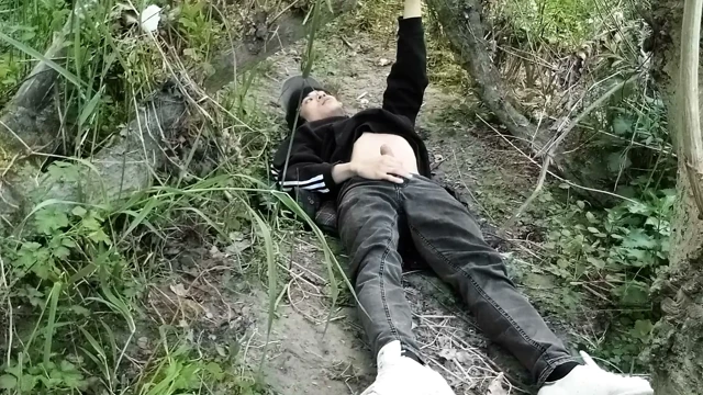 This gay twink sticks his cock through his fly to jerk off outside