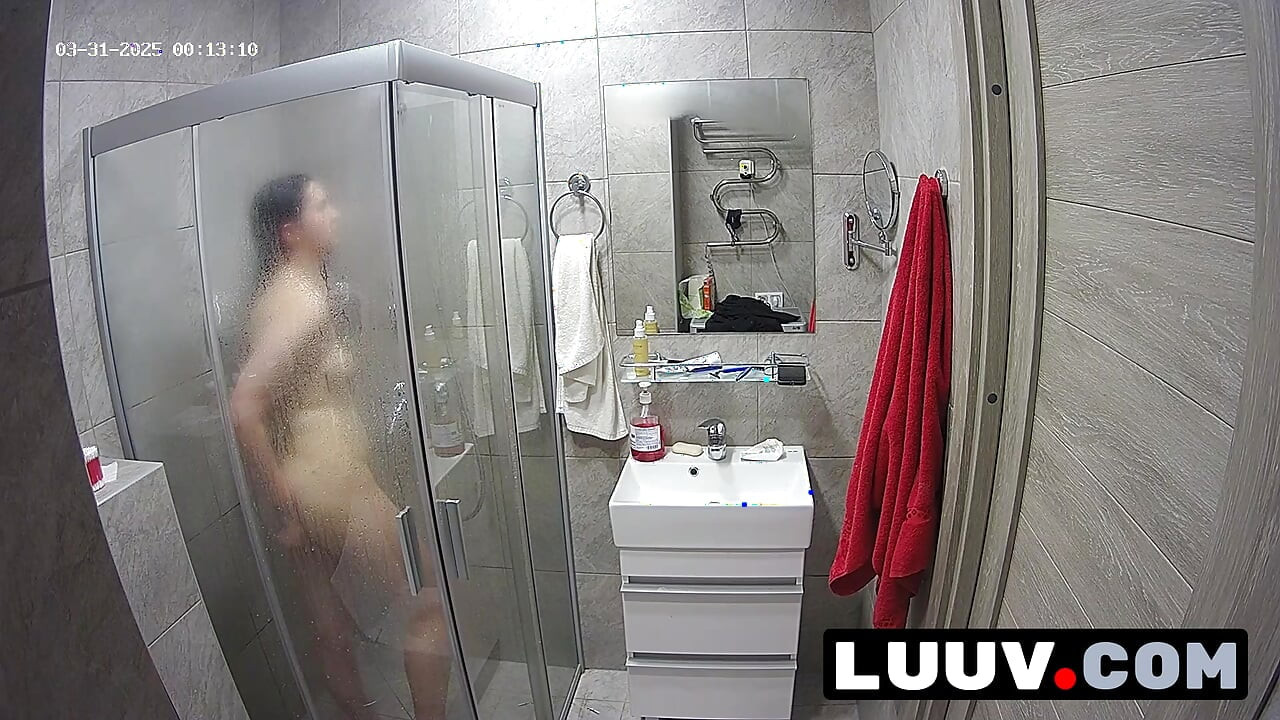 LUUV. A brunette showers, used to amateur cameras, showing her natural body