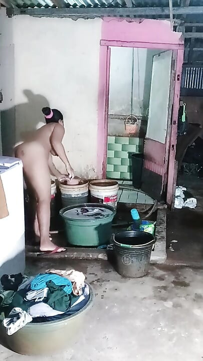 Washing clothes while naked