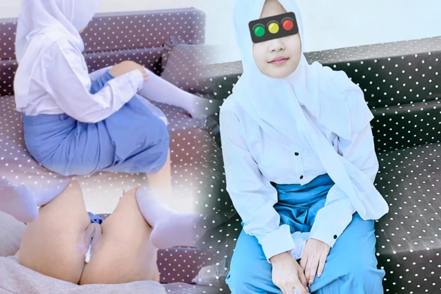 A student walks out of school because it's raining.