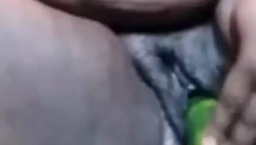 Ebony fucks cucumber and shows asshole