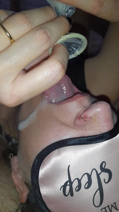 The young whore swallows the sperm directly from the condom after passionate sex with the gifted boy