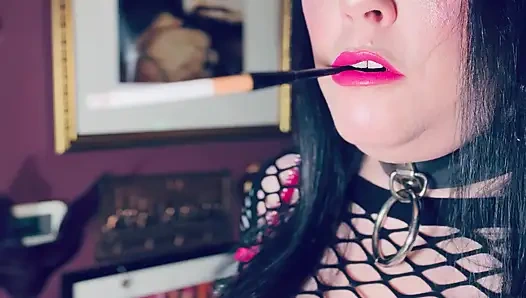 Pink & Delicious Tina Snua Sparks Up A Cigarette In A Holder