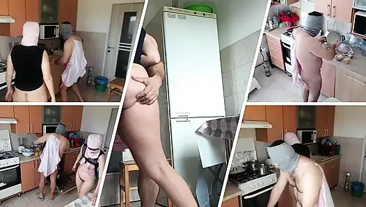 Amateur couple having fun in the kitchen. A sexy hairy brunette does the housework naked.