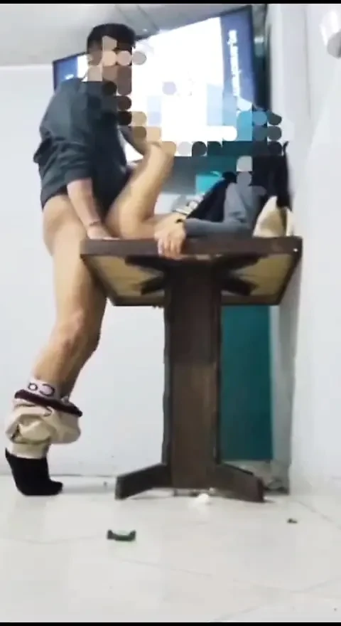 with a co-worker at an owner's table