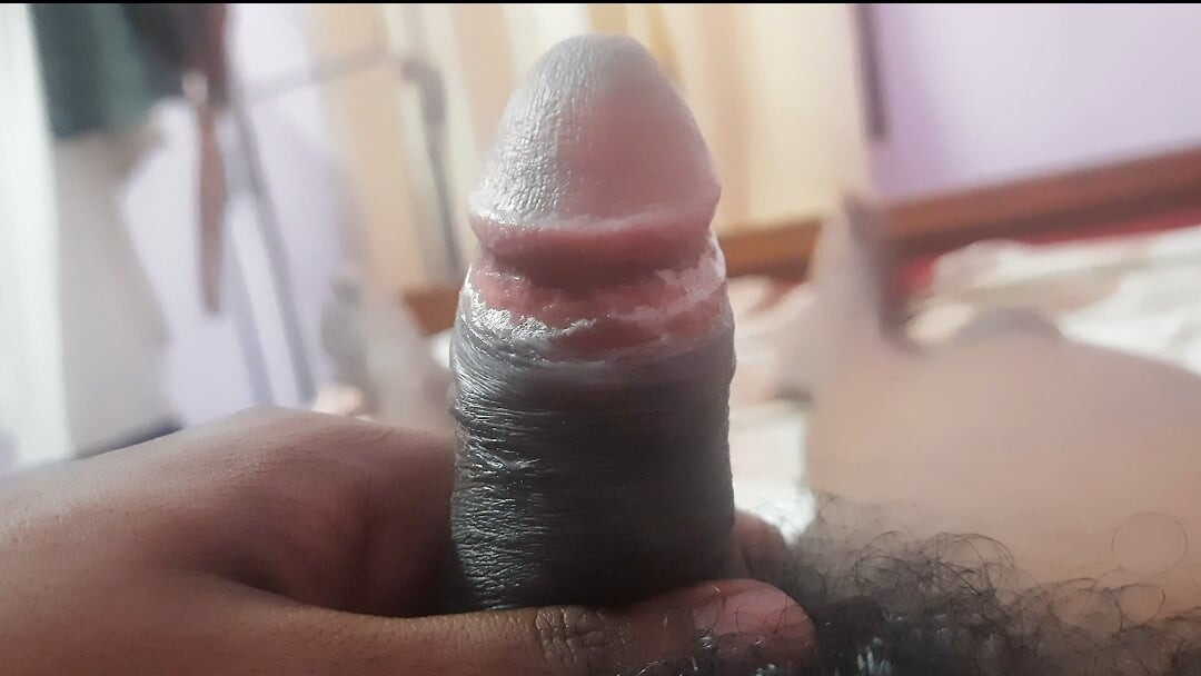 An Indian youth is engaging in intimate moments in his residence.