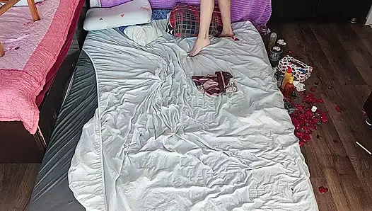 Sensual massage of a sexy couple with oil on the body. Foreplay in the bedroom with an amateur couple.