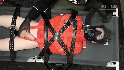Bondage Twink Strapped to Campbed in Straitjacket and Gas Mask