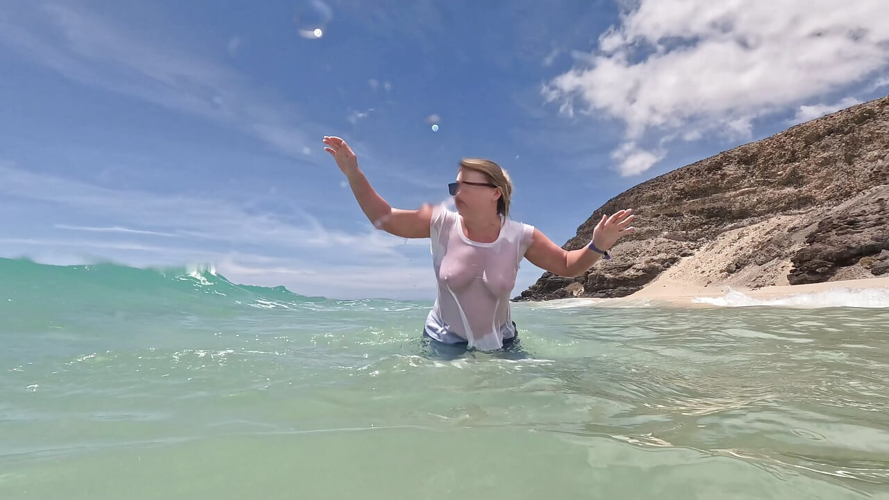 Girl Wetting Jeans in the Ocean and Swimming in Wet White T-shirt