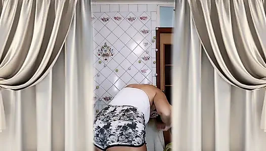 Housewife Lukerya warms up in the kitchen and flirts playfully on webcam.