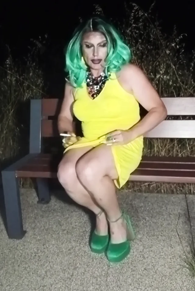 Sexy mature transvestite slut party summer showing off in a public park