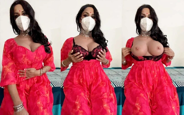 Kırmızı elbiseli büyük memeli travesti