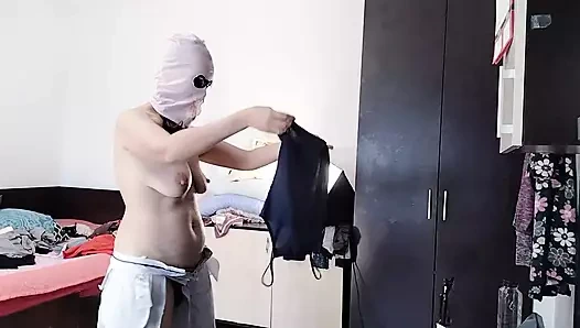 Amateur wife enjoys trying on clothes and cutting them. Amateur wife dances naked in the house.