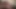 İri göğüslü orta yaşlı seksi kadın Kristine Swank seksi tanga külotu ve yüksek topuklu çizmelerle büyük götünü gösteriyor ve pembe amcığını iki dildoyla sikiyor