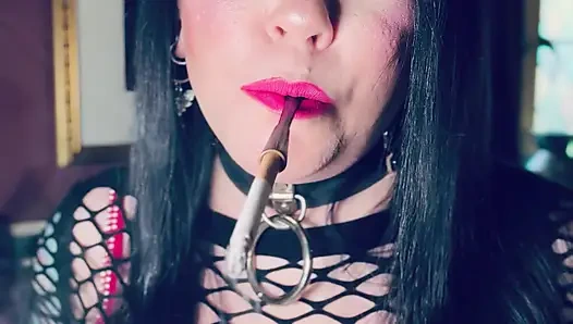 Pink & Delicious Tina Snua Sparks Up A Cigarette In A Holder