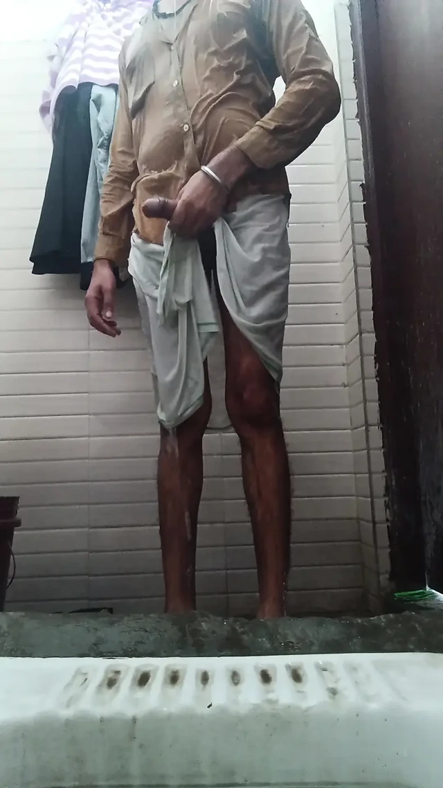The boy of the village took out the thick penis from inside the lungi and took out the semen