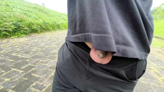 A young boy with a small foreskin exposes himself in the woods
