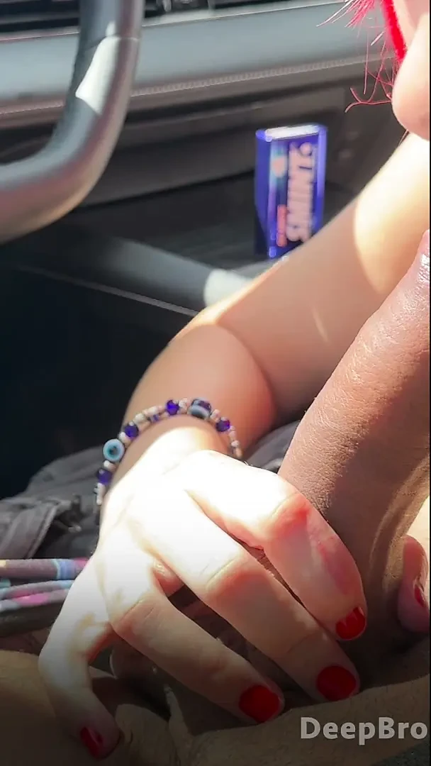 Redhead deepthroats thick BBC in the car, fingers gripping tight