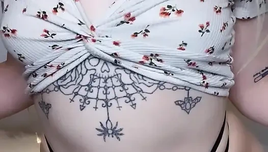 amateur tattooed blonde oils her pierced tits