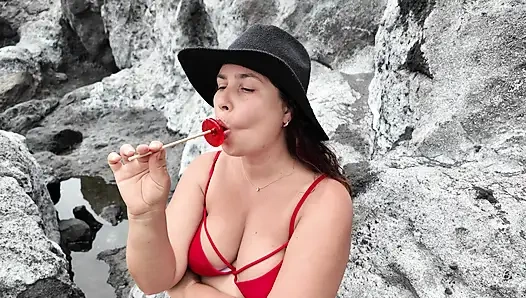 A StepMom practices sucking on a candy on the beach. Then tests her skills on her StepSon's Dick