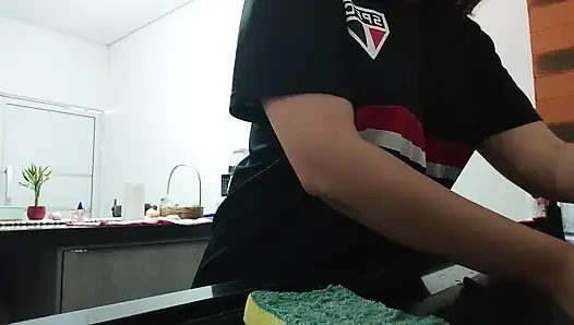Woman teasing while washing dishes. She loves to transmit to the voyeurs on duty