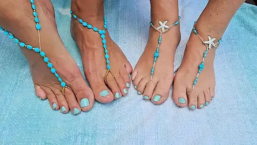 Playing footsie together in the sun for all to see while wearing barefoot jewelry