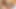 Redhead ladyboy in green bra jerks off her hairy dick in bed