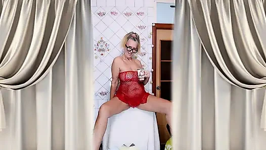 Hot housewife Lukerya flirts over morning coffee in a red mesh dress.