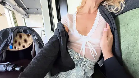 Drinking coffee in a see through shirt exposing pierced nipples in public cafe while my husband touches my boobs