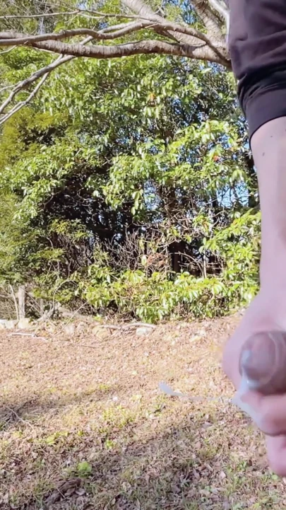 A slender, uncircumcised boy exposes his penis outdoors, masturbates right there, and ejaculates immediately. | Clip 1