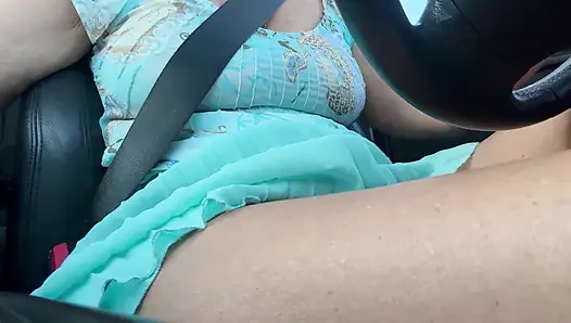 An elegant lady drives to work and rubs her pussy with her hand between her hot thighs