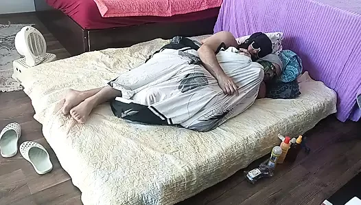 Sensual massage of a sexy couple with oil on the body. Foreplay in the bedroom with an amateur couple.