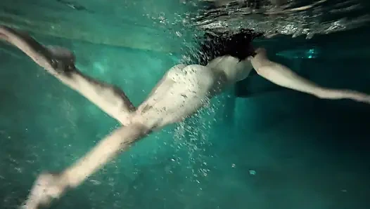 redhead girl swimming naked in pool