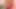 Seksi kızıl saçlı bebek Eva Barbie yatakta bir seks oyuncağıyla oynuyor.